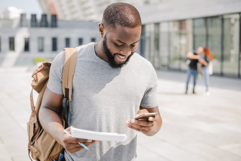 college student looking at phone